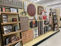 a store display with sports related items on the wall