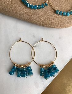 Elegant Blue Apetite Stones beaded and dangle in either choice of silver plated hoops, sterling silver hoops, gold plated hoops, or 14k gold filled hoops. Perfect bohemian jewelry, perfect size and dangle. Super gorgeous with boho outfits. Light and comfortable. Make a statement today! 💜Simple, Dainty and Elegant Raw Natural Stones for everyday wear that's lasting. Simple yet elegant especially the shine and color are so gorgeous.The picture does not do it justice it and is much prettier in per Blue Small Hoop Jewelry With Dangling Beads, Blue Small Hoop Earrings With Dangling Beads, Handmade Apatite Dangle Jewelry, Handmade Blue Apatite Earrings, Everyday Blue Jewelry With Dangling Beads, Blue Hoop Earrings With Natural Stones, Blue Hoop Jewelry With Natural Stones, Blue Natural Stone Hoop Jewelry, Blue Natural Stone Dangle Hoop Earrings