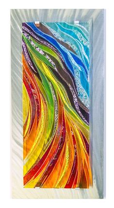 an abstract painting with multicolored lines in it's glass frame on the wall