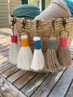 some tassels are in a basket on a table