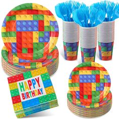 birthday party supplies including plates, cups, and napkins with lego blocks on them