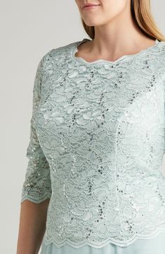 Scalloped stretch lace alight in sequins layers the bodice of this formal dress with a flowing chiffon skirt that gives the illusion of coordinated separates. 47" length (size 18W) Hidden back-zip closure Bateau neck Elbow-length sleeves Bra friendly Lined, except sleeves 58% nylon, 40% polyester, 2% spandex with 100% polyester contrast Hand wash, dry flat Imported Women's Clothing Evening Mother Of The Bride Dress With Scalloped Lace, Formal Lace Dress With Illusion Neckline And Fitted Bodice, Elegant Lace Mother Of The Bride Dress With Sequins, Formal Mother Of The Bride Dress With Scalloped Lace, Scalloped Lace Mother Of The Bride Dress For Party, Elegant Spring Lace Sequin Dress, Glamorous Lace Mother Of The Bride Dress With Sequins, Elegant Spring Sequin Lace Dress, Elegant Lace Sequin Dress For Spring