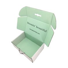 an open box with the lid opened on a white background that says blooming beautiful