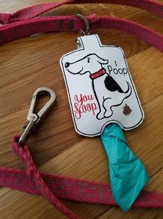 there is a dog tag with a leash attached to it that says you poop