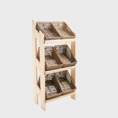 three wooden shelves with baskets on each shelf and a chalkboard attached to the top