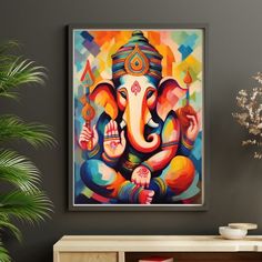 an elephant painting hanging on the wall in a living room next to a potted plant