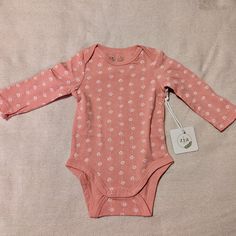 This Onesie/Bodysuit From The Boutique Brand Zia Nyc Is Decorated With A Cute Heart Print That Consists Of A Dotted Heart, A Solid Heart, And Dots Connecting Them Into A String Of Hearts. It Has Shoulder Flaps, Long Sleeves, And 3 Snaps At The Bottom. The Lightweight Material Is 95% Cotton And 5% Spandex. Nwt; Received As A Gift And Never Used. Machine Washable. Playful Long Sleeve Spring Bodysuit, Fitted Long Sleeve Bodysuit For Playtime, Playful Long Sleeve Fitted Bodysuit, Cute Long Sleeve Bodysuit For Playtime, Cute White Long Sleeve Bodysuit, Cute Pink Stretch Bodysuit, Fitted Short Sleeve Pink Bodysuit For Playwear, Cute White Stretch Bodysuit, Basic Fitted Onesie For Spring