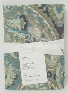 the package is wrapped in blue and green paisley fabric