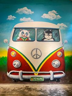 a painting of a vw bus with cats on the front and back window, painted in bright colors