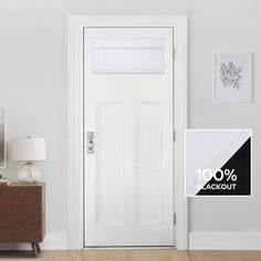 a white door with a black and white sign next to it that says 100 % blackout