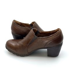 Experience comfort and style with BOC Born Concept Women's Leather Booties in size 41 Brown. Expertly crafted with a big solid heel, these pre-owned booties offer stability and effortless fashion. Perfect for any occasion, step out in confidence with BOC. Brown Faux Leather Boots With Leather Sole, Brown Slip-on Boots With Stacked Heel, Brown Leather Sole Heeled Boots For Office, Brown Heeled Boots With Leather Sole For Office, Brown Heeled Boots For Office With Leather Sole, Brown Heeled Boots With Leather Lining For Office, Brown Leather Lined Heeled Boots For Office, Brown Leather Lined Boots For Office, Office Brown Heeled Boots With Leather Sole