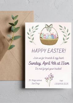 an easter card with the words happy easter on it next to a brown envelope and green leaves