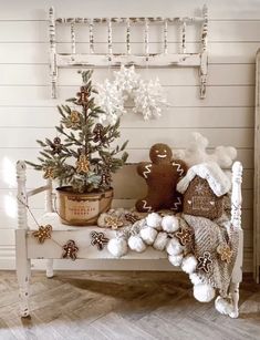 a small christmas tree sitting on top of a white bench