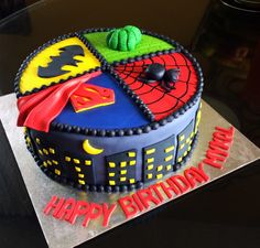 a birthday cake decorated with the theme of batman and spider - man