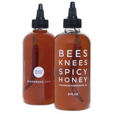 two bottles of bee's knees spicy honey are shown in this undrecognistically photo