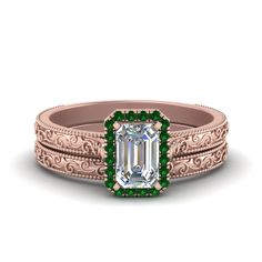 an emerald engagement ring set with filigrees in 18k rose gold,