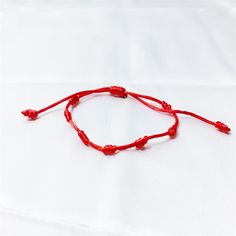 Material: Red Rope Color: Glossy One, Thread Type One Style: Simple Trendy Red Adjustable Braided Bracelets, Trendy Adjustable Red Braided Bracelets, Casual Red Braided Bracelets For Beach, Casual Red Braided Bracelet For Beach, Red Adjustable Friendship Bracelets For Summer, Trendy Red Friendship Bracelets, Casual Red Bracelets For Beach, Casual Red Beach Bracelets, Casual Red Beach Bracelet