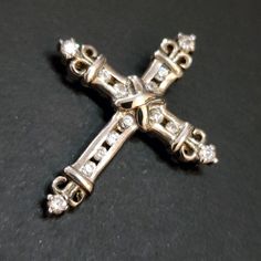 "This is a sterling silver cross pendant and is stamped \"925\" on the back. It has a sparkly clear CZs inlaid. Bail loop is on the back. The back of the pendant is flat other than the loop. CROSS SIZE 1.25 inches tall 1 inch wide This would make a great gift for wife, sister, mother, grandmother, daughter, husband, children, siblings, father, grandchildren, etc. My family acquired a large set of jewelry back in 2000 from a jewelry store that went out of business. These pendants are part of that White Gold Cross Charms For Anniversary, Sterling Silver Cross Charms For Anniversary, Sterling Silver Crucifix Jewelry In Diamond White, Sterling Silver Cross For Anniversary, Sterling Silver Cross Pendant Necklace For Anniversary, Sterling Silver Cross Jewelry For Anniversary, Diamond White Sterling Silver Crucifix Jewelry, Classic 925 Stamped Cross Jewelry, Silver Cross Diamond Jewelry