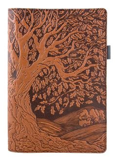 a brown leather journal with a tree on it