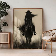 a black and white photo of a cowboy riding a horse with long hair on it's back