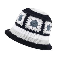 a black and white crocheted hat with flowers on it