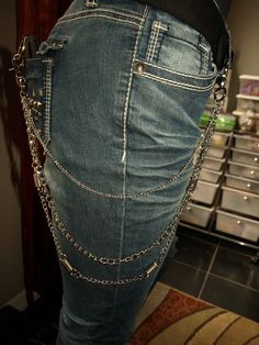 Three silver chains of varying link sizes. The longest chain has faux spring charms spaced throughout. Sturdy lobster clasps can be used to secure keys and wallet, or attach to belt loops as a decorative accessory to any outfit. Heart Wallet, Chain Jeans, Chain Pants, Jeans Chain, Silver Wallet, Silver Pants, Aluminum Wallet, Pant Chains, Dress Up Jeans