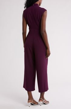 A contrasting buckle defines the waist of this woven jumpsuit that's cut right at your ankle for trend-right charm. 25 1/2" inseam Hidden back-zip closure Mock neck
 Cap sleeves Side-seam pockets Removable waist tie 66% polyester, 30% recycled polyester, 4% spandex Dry clean Imported Purple Fitted Jumpsuits And Rompers For Work, Purple Fitted Jumpsuits And Rompers For Formal Occasions, Fitted Purple Jumpsuits And Rompers For Formal Occasions, Chic Purple Jumpsuits And Rompers For Work, Calvin Klein Jumpsuits And Rompers For Workwear, Fitted Purple Jumpsuit For Formal Occasions, Calvin Klein Fitted Jumpsuits And Rompers For Work, Calvin Klein Fitted Workwear Jumpsuits And Rompers, Fitted Calvin Klein Jumpsuits And Rompers For Party