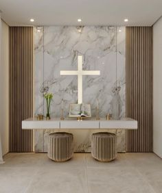 a room with two stools and a cross on the wall