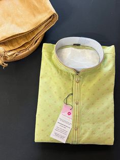 Pista Green Kurta with Self Weave design and Zari Weave. Item : Men's Kurta PajamaReady to Wear : YesKurta Color : Pista Green Color (Green Color Family)Pajama Color : Gold Fabric : Jute Silk Lining (Yes/No) : No (You can wear a soft cotton T-shirt in case of sensitive skin)Disclaimer -For sizing please refer to the Size Chart given in the listing with the pictures. - Please do NOT go by the size of the Kurta that you already have from another maker. All makers have different size Charts. - Size Self Embroidery, Pista Green Colour, Wedding Kurta, Wedding Kurta For Men, Kurta For Men, Pista Green, Men's Kurta, Silk Kurta, Kurta Pajama