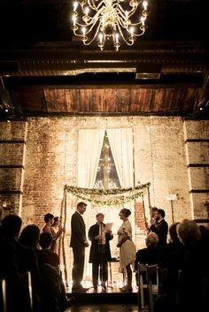 a group of people standing in front of a stage