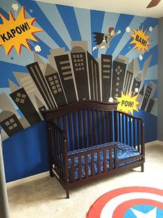 a baby's room with a captain america mural