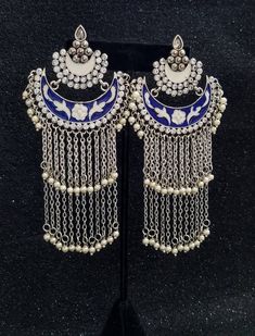 Gorgeous handmade long Indian meenakari dangly earrings, in chandbali design. Two tiers of dangling chains with pearl beads, suspended from colorful enamel crescent. Rows of clear crystals add bling. Feminine and so romantic They give a delicate effect. Lightweight and comfortable to wear. Weight is 8/10 ounce/ 23 grams. find even more great earrings here: https://www.etsy.com/shop/boutiquebymaryam?section_id=22797814 check out the rest of my shop here: https://www.etsy.com/shop/boutiquebymaryam Metal Chandbali Chandelier Earrings With Latkans, Dangle Metal Chandbalis With Latkans, Dangle Chandbalis With Latkans In Metal, Bollywood Style Metal Chandelier Earrings With Latkans, Bollywood Metal Chandelier Earrings With Latkans, Metal Chandbalis With Latkans, Bohemian Tilla Dangle Earrings, Festive Bridal Dangle Earrings With Latkans, Heavy Chandbali Chandelier Earrings In Metal