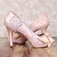 "Dress up your trip down the aisle with these 3 1/2\" custom wedding shoes (measured like this: http://www.customweddingshoe.com/about-ellie-wren/heel-height-measurement/). These shoes are shown in blush with a silver lace overlay, a hand made matching bow on the toe and hand made blush buttons on the back. Color Change: Want this shoe in a different color? We can change the base shoe color for you! To order this shoe in a different color, please send us a CUSTOM REQUEST. To view our catalogue o Vintage Inspired Wedding Shoes, Bow Wedding Shoes, Lace Wedding Heels, Simple Wedding Shoes, Blush Wedding Shoes, Dream Wedding Shoes, Lace Bridal Shoes, Heels Bow, Unique Wedding Shoes