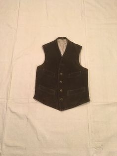 "Vintage 1890s waistcoat United Garment Workers of America 1891 union tag lot # 1286 dark brown corduroy dark brown back striped lining button up (top button gone) 4 front pockets 1 inside pocket cinch tab buckle back good vintage condition, light wear/stain on lining in amazing shape for age smaller than labeled size 36/see below measures, lying flat, shoulder-13\" chest-16 1/4\" hem-16\" 1\" side slits" 1890s Waistcoat, Mens Formal Vest, Formal Vest, Buffalo Plaid Shirt, Garment Workers, Army Pants, Cocktail Dress Vintage, Mens Vests, Brown Corduroy