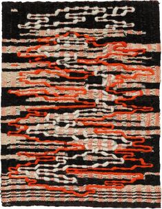 an old black and red rug with many lines on it