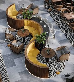 an overhead view of a restaurant with tables, chairs and couches on the floor