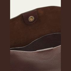 Il Bisonte "Snodo" crossbody bag in leather  Adjustable knot crossbody strap, 10.7" drop Can be worn as a shoulder or crossbody bag  Open top with snap closure  Interior, one slip pocket  Lining: Suede Approx. 13"H x 11.8"W x 3.9"D Item Weight (Lbs.): 1.7 Made in Italy Leather Crossbody Bucket Bag With Magnetic Closure, Brown Leather Bucket Bag With Magnetic Closure, Leather Lined Crossbody Bucket Bag For Work, Adjustable Knot, Open Top, Crossbody Strap, Leather Crossbody Bag, Leather Crossbody, Snap Closure