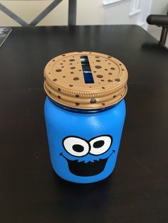 a cookie jar with a cookie face painted on it