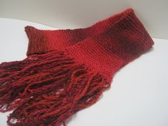 Handmade long knit scarf. Red knitted scarf. Size 5 " X 63" inches. Ready to ship. This nice hand knit scarf. is so soft and warm. I love all the shades of red. will be great with black or dark blue coat or any of your out fits. Makes for a nice gift also. Check out my shop for other colors. When I was 6 years old, I took 4H knitting. I won first place for my mittens. I have been knitting ever since making up my own patters. and selling my scarves at shows. I fined knitting very relaxing. Feel f Red Knitted Scarf For Fall, Red Knitted Fall Scarves, Red Knitted Fall Scarf, Red Knitted Scarf For Winter, Red Hand Knitted Scarf One Size, Red Hand Knitted Scarves One Size, Hand Knitted Red Yarn Knitting Pattern, Red Hand Knitted Yarn Knitting Pattern, Red Yarn Knitting Pattern