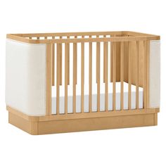 a wooden crib with white sheets on the bottom and side panels, in front of a white background