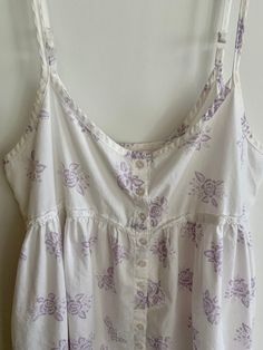 Cute vintage white cotton Victoria's Secret short and shabby lavender floral babydoll top or nightie.  I think the lavender floral sprays were meant to be somewhat faded.  They may be a bit more do than when new.  Eyelet trim at bottom. Eyelet trim at bodice  Button up front.  Adjustable straps.  Billowy! Tagged size medium Note armholes in last three photos show a tiny amount of yellowing and possible color transfer from wash and wear.  Slight, but there.  Bust flat is 17 inches 32 inches long Lavender Cotton Sleepwear For Spring, Purple Cotton Bedtime Top, White Cotton Cottagecore Sleepwear, White Cottagecore Cotton Sleepwear, Lavender Cotton Sleepwear For Summer, Cotton Floral Print Sleep Top, Cottagecore Cotton Sleepwear With Lace Trim, Summer Cotton Nightgown With Floral Print, Summer Cotton Floral Print Nightgown