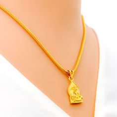 This attractive pendant, exquisitely crafted from 22k gold and weighing 3.2 grams, features a finely engraved depiction of Sai Baba set against a luminous yellow gold finish. The pendant has a length of 0.9 inches, making it both noticeable and modest in size, ideal for daily wear. Perfect for devotees who wish to keep Sai Baba close to their hearts, this pendant combines spiritual devotion with elegant craftsmanship, offering a timeless piece that embodies grace and serenity. PRODUCT DETAILS Gold Purity(karat): 22k Gold Weight(grams): 3.2 Item Finish: Yellow Gold Pendant Length: 0.9" Chain: Not Included Gold Temple Necklace With Round Pendant Amulet, Gold Plated Pendant Necklace For Diwali, Gold Plated Necklaces For Diwali Gift, Spiritual Gold Necklace In 22k, 22k Gold Amulet Necklace, Traditional Gold Plated Engraved Necklace, Traditional Gold-plated Engraved Necklace, Spiritual 22k Gold Necklace, Traditional Engraved Gold-plated Necklace