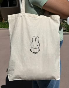 A canvas tote bag with an embroidered miffy character Dimensions: 15"L x 16"H 9 1/2" handle drop 100% Cotton Miffy Bag, Orange Tote Bags, Tote Bag Custom, My Best Friend's Birthday, Cute Tote Bags, Best Friend Birthday, Birthday Wishlist, Custom Bags