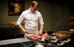 a man is preparing food in the kitchen