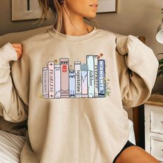 Taylo Version Albums As Books Shirt, Taylor's Album As Book Sweatshirt White Graphic Print Bookish Tops, White Graphic Print Top, White Bookish T-shirt For School, Bookish Crew Neck Top With Character Print, Fall Graphic Print Bookish Tops, Fall Bookish Tops With Graphic Print, Spring Graphic Print School Sweatshirt, Spring Graphic Print Sweatshirt For School, Graphic Print Sweatshirt For School In Spring