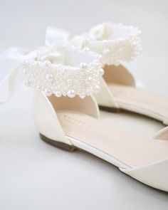 Shiny and glamorous satin flats with all over pearls ribbon strap. Elegance and feminine inspired wear for your special day. The delicate pearl beads are placed to create a graceful classic style. Perfect for brides, bridal party, bridesmaids, prom, parties, or any special occasion. DETAILS: UPPER: Synthetic upper and lining MATERIALS: Manmade outsole ORIGIN: Imported Flat Shoes For Bride, White Satin Bow Wedding Shoes For Bridesmaids, White Pearl Embellished Wedding Shoes For Bridesmaids, Peach Champagne Wedding, Flat Wedding Shoes For Bride, Bride Flats, Bridal Things, Socks For Flats, Bridal Flats