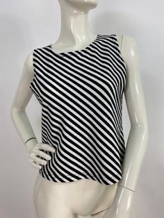 "Black and white top, black and white striped top, size large  Measurements:  Shoulder (outer seam-seam)13\"/bust(pit-pit)18\"/waist 17\"/bottom width 18\"-24\"/length 19\" Mannequin measurements:  5'8\", bust 34\", waist 25\", hip 33\" Please note that vintage clothing sizes can vary greatly.  The Measurements provided  are approximate and are taken lying flat.  I suggest taking a similar garment from your wardrobe and measure it while lying flat.  This way you can compare measurements.  All of Matching Top And Skirt, Black And White Striped Top, Silk Midi Skirt, White Midi Skirt, Black And White Top, Fashion Bug, Black And White Tops, Black And White Blouse, 1940s Fashion