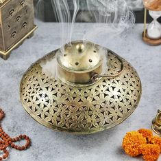 "* 🔥 Free 20 CONES included🔥 * LARGE in Size* ➤Note: Please Check the Dimensions Before Order!! This \"Antique Vintage Incense Burner\" is of Big Size!!  ➤Package Includes: 1 Iron Incense Burner, 1 Brass Cone Holder Pin, 1 Cone/Candle Holder, 1 Iron Wall Bracket (Hanger), 2 Brass Bells, 1 Brass Chain, 2 Screws, 20 Cones . ➤This incense holder has been done with antique golden polish which gives it a vintage look. You can either use it with a hanger or without a hanger. ➤Hand crafted in India ( Candle Table Decorations, Meditation Room Decor, Metal Home Decor, Meditation Decor, Puja Room, Spiritual Decor, T Lights, Wall Bracket, Brass Bells