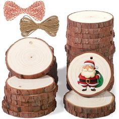 a wooden slice with a santa clause on it next to some wood slices and a bow tie