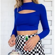 Get Ready For Lots Of Blue This Fall! This Royal Blue Longsleeve Top Is Sure To Make You Feel Like A Star With Its Saturated Color And Cute Out. It Also Has A Mock Neck And A Cropped Fit. Seen Paired With The Never Have I Ever Checkered Mini Skirt. True To Size. Model Is 5'7 80% Polyester 14% Rayon 6% Spandex Blue Long Sleeve Crop Top For Night Out, Blue Long Sleeve Trendy Crop Top, Trendy Blue Long Sleeve Crop Top, Blue Cropped Top For Fall, Blue Stretch Crop Top For Fall, Blue Casual Crop Top For Night Out, Casual Blue Crop Top For Night Out, Open Crop Top, Checkered Mini Skirt